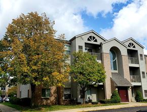 Detroit apartment for rent - an apartment building with a tree in front of it