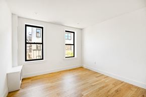 Brooklyn apartment for rent - the living room of an apartment with wood floors and two windows