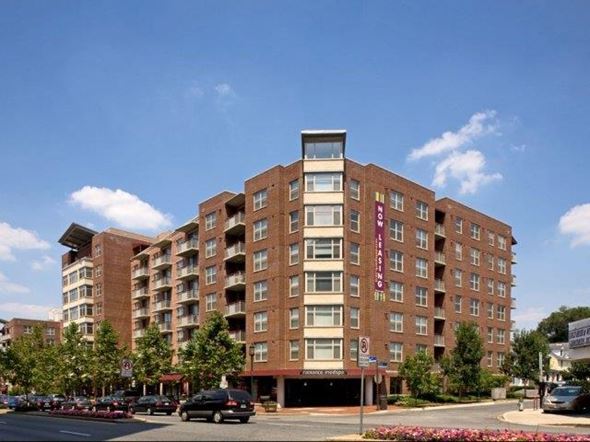 Bethesda apartment for rent - a large brick building with cars parked in front of it
