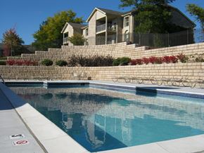Northville apartment for rent - a swimming pool with a house in the background
