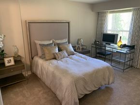Northville apartment for rent - a bedroom with a bed and a desk with a tv