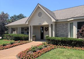 Northville apartment for rent - the front of a house with a walkway and landscaping