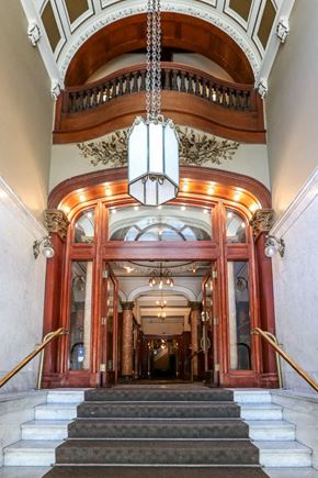San Francisco apartment for rent - the lobby of a building with stairs and a chandelier