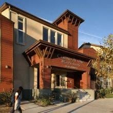 Los Angeles apartment for rent - a woman walking down a sidewalk in front of a building