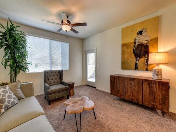 Chico apartment for rent - a living room with a couch and a ceiling fan