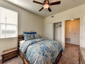 Chico apartment for rent - a bedroom with a bed and a ceiling fan