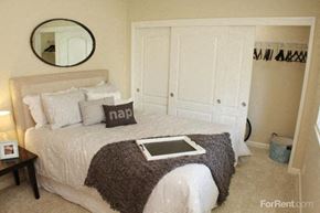 Sacramento apartment for rent - Two-Bedroom Apartments in Sacramento CA - La Provence - Large Closet, Wall Mirror, Wall-to-Wall Carpet, and Brown Nightstand
