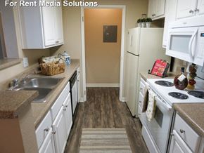 Modesto apartment for rent - The Marina in Modesto kitchen area with white appliances and cabinetry