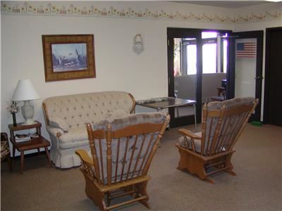 Nashwauk apartment for rent - a living room with two rocking chairs and a couch