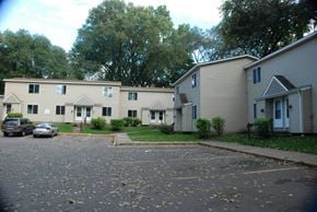 St. Paul townhouse for rent - an empty parking lot in front of a row of houses