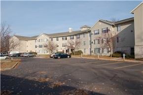 Circle Pines apartment for rent - an empty parking lot in front of an apartment building