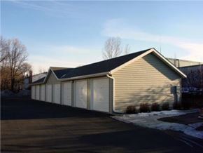 Circle Pines apartment for rent - a building with a garage and a parking lot