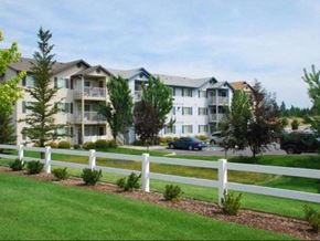Spokane Valley apartment for rent - Community view from grass and fence Apartments in Spokane Valley, WA| Parkside Mirabeau Apartments
