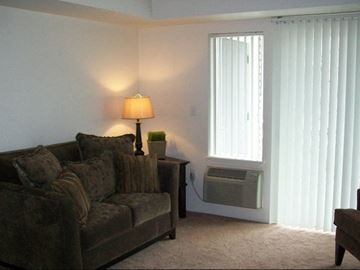 Spokane Valley apartment for rent - a living room with a couch and a lamp
