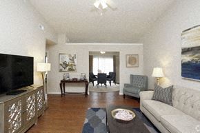 Westfield apartment for rent - A living room with a grey couch, a coffee table, and a television.
