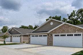 Westfield apartment for rent - A house with a grey roof and a stone chimney.