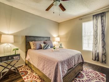 Beautiful bright bedroom with wide windows