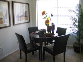 Albuquerque apartment for rent - A dining room with a table set for four.