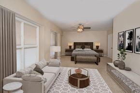 Austin apartment for rent - a bedroom with a bed and a couch in a room with a rug