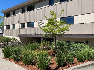Burlingame apartment for rent - an office building with a garden in front of it