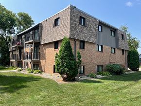Morris apartment for rent - a brick apartment building with a tree in the yard