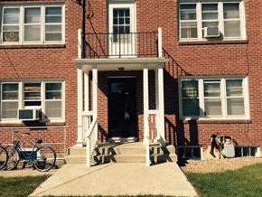 Morris apartment for rent - a brick house with a porch and a bike parked in front of it