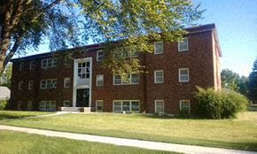 Morris apartment for rent - a red brick building with a lawn in front of it