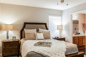 Greer apartment for rent - A bedroom with a large bed and a wooden dresser.