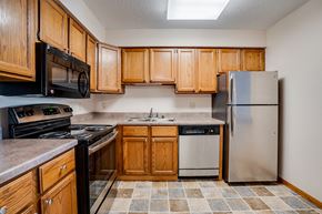 La Crosse apartment for rent - Kitchen with wooden cabinets and stainless steel appliances