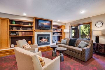 La Crosse apartment for rent - a living room with couches and chairs and a fireplace