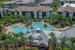 Jacksonville apartment for rent - A large resort with a pool and palm trees at Cabana Club Apartments, Jacksonville, FL, 32256