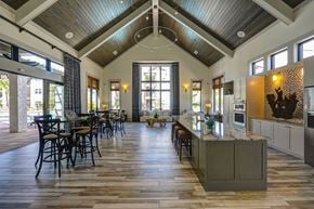 Jacksonville apartment for rent - A large open kitchen and dining room with a wooden ceiling and floor at Cabana Club Apartments, Florida