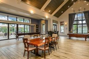 Jacksonville apartment for rent - A dining room with a wooden table and chairs at Cabana Club Apartments, Jacksonville, FL, 32256