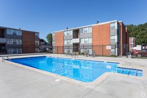 Kalamazoo apartment for rent - our apartments offer a swimming pool with our building in the background