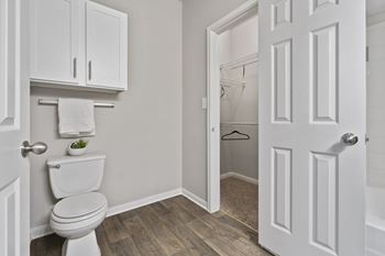 Luxury package includes: white cabinetry in kitchen & bathrooms, black appliance package, granite-style countertops, updated flooring, lighting & hardware,  two-tone designer paint & framed bathroom mirrors