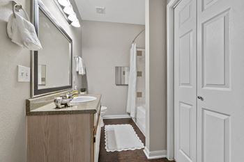 Premiere package includes: black appliance package, granite-style countertops, updated flooring, lighting & hardware,  two-tone designer paint & framed bathroom mirrors