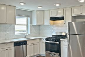 Oak Park apartment for rent - A kitchen with a stove, oven, and refrigerator.