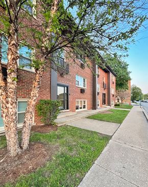 Oak Park apartment for rent - A tree in front of a red brick building.