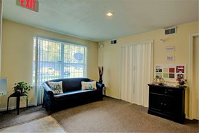 Kansas City apartment for rent - Image of carpeted room with furniture and window