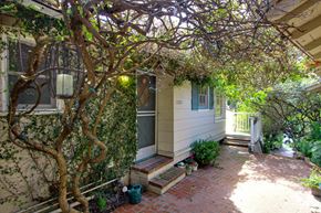 Los Angeles apartment for rent - the front of the house with a porch and a tree