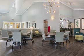 Palatine apartment for rent - a dining room with a table and chairs and a chandelier