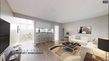 Downey apartment for rent - a living room with a couch and a table and a kitchen