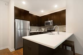Mount Arlington apartment for rent - a kitchen with a large island and stainless steel refrigerator