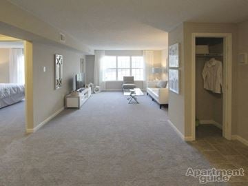 Ballston Spa apartment for rent - a large living room with a white carpet and a bedroom