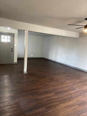 Denton house for rent - A room with wooden floors and white walls.