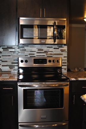 Denton apartment for rent - a stainless steel stove and microwave in a kitchen