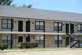 Aubrey apartment for rent - a building with a balcony and a staircase