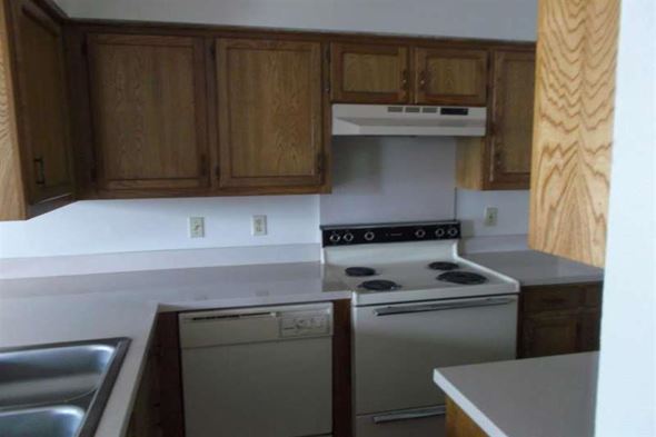 Aubrey apartment for rent - a kitchen with a stove top oven and a sink