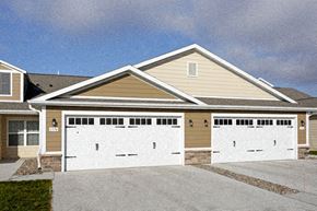 Ankeny apartment for rent - A two-car garage is attached to a house.