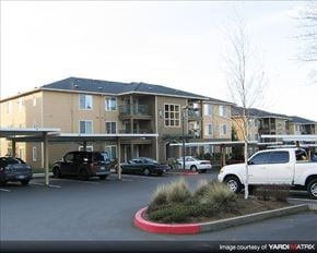 Gresham apartment for rent - A parking lot in front of a building with cars parked.